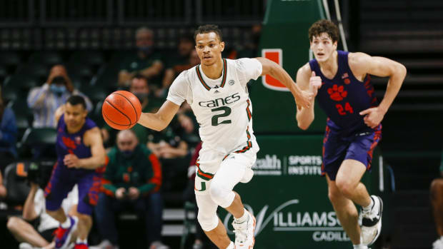 Dec 4, 2021; Coral Gables, Florida, USA; Miami Hurricanes guard Isaiah Wong (2) dribbles the basketball against the Clemson Tigers during the second half at Watsco Center. Mandatory Credit: Sam Navarro-USA TODAY Sports